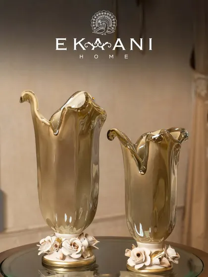 Crafted in Murano, admired everywhere. These vases, with their flowing forms and delicate porcelain rose bases, blur the line between decor and art, bringing a touch of Italian luxury to your home.