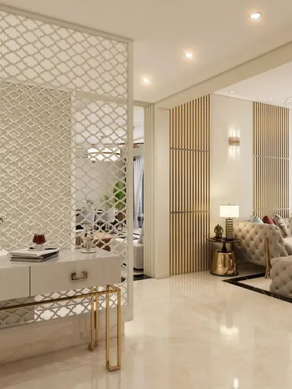 The foyer view towards the living room, separated by a decorative jaali screen that provides privacy while maintaining an open feel.