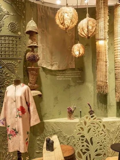 A curated corner of the 'Edge of the Forest' installation, showcasing traditional materials and techniques. The space combines handcrafted objects, natural textures, and artisanal products to tell a story of healing through ancestral wisdom.