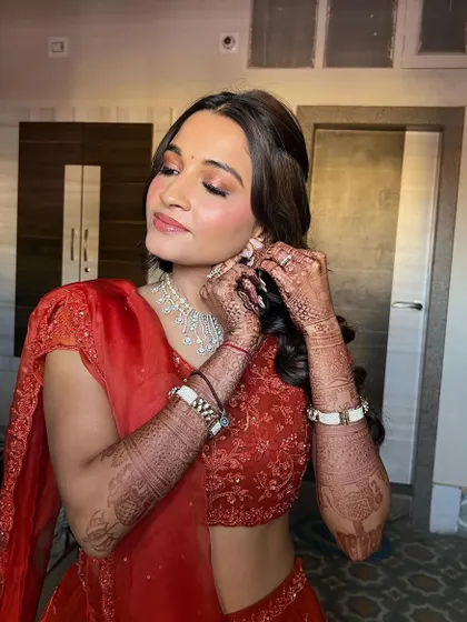 A candid moment, showing the beautiful coral makeup. This look is perfect for a daytime event, adding a touch of warmth and radiance.