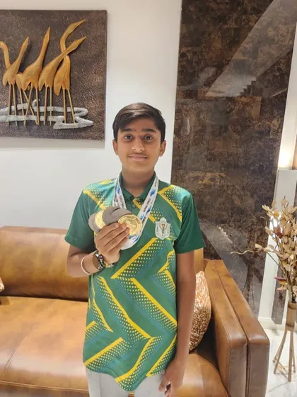Aryan Sagar Chandra with his impressive collection of gold and silver medals from the Splash N' Dash Interschool Competition.