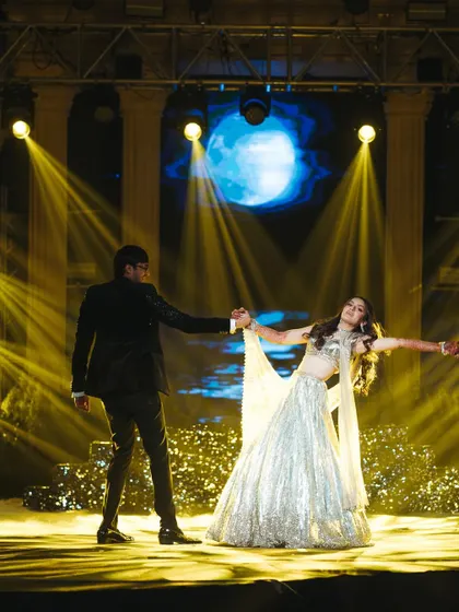 A classic romantic dip against a stunning stage backdrop. We work with your event planners to ensure our choreography complements the entire visual setup of your sangeet.
