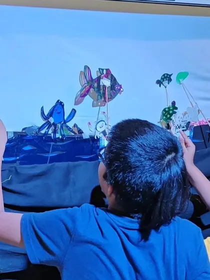 A behind the scenes look at our children's shadow puppetry workshop, where kids learn to tell stories with light and shadow.