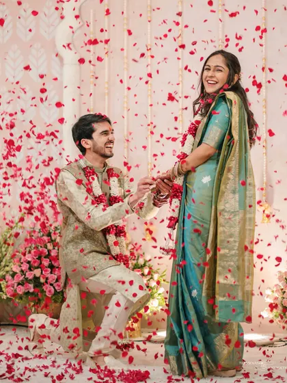 The pure, unscripted joy of a proposal. We are there to capture the peak emotions of your engagement ceremony, like this beautiful moment showered in rose petals.