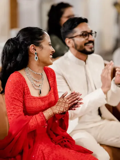 A happy, candid moment during the sangeet. Her makeup looks fresh and radiant, even in the middle of the celebrations.