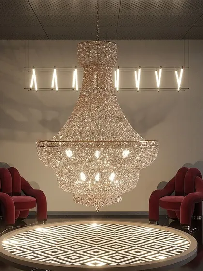 A massive, glittering chandelier serves as the centerpiece in this section of the light showroom, creating a breathtaking display of luxury and craftsmanship.