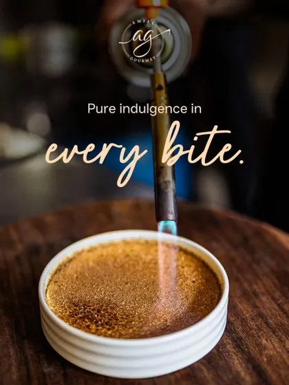 The magic is in the details. Here, I am caramelizing the sugar on my Crème Brûlée, creating that signature crackly top that gives way to a silky, vanilla-infused custard. It is pure indulgence in every bite.