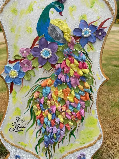 The peacock is a symbol of abundance and beauty, making it a perfect subject for my art. In this piece, I sculpted its body and then created a magnificent tail from hundreds of tiny, multi-colored petals.