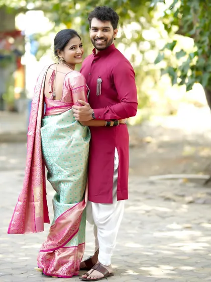 A bright and happy portrait of the couple. The bride looks back with a smile, holding her groom's hand, capturing a moment of connection and joy.