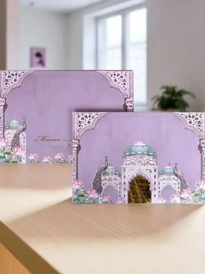 This lavender Pichwai card is adorned with graceful peacocks and lotus flowers, creating an elegant and serene design for a sophisticated wedding.