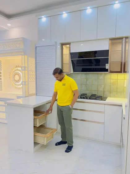 Here I am showing the pull-out wicker baskets integrated into the breakfast counter. It's a practical placement for items you use daily.
