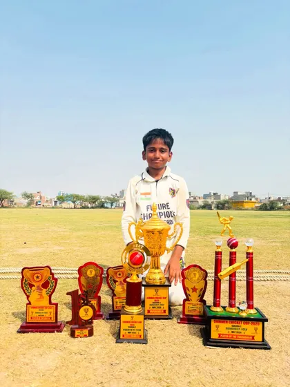 Rishabh Singh showcasing his impressive haul of trophies from the tournament. A true champion in the making.