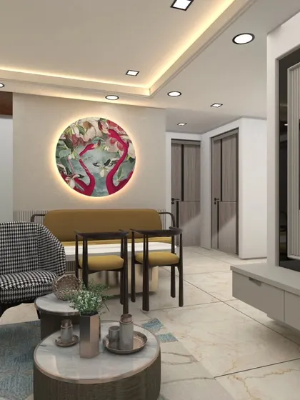 This design shows how to create distinct zones in an open-plan living area. A stylish two-seater sofa and a circular art piece define a cozy seating nook separate from the main lounge.
