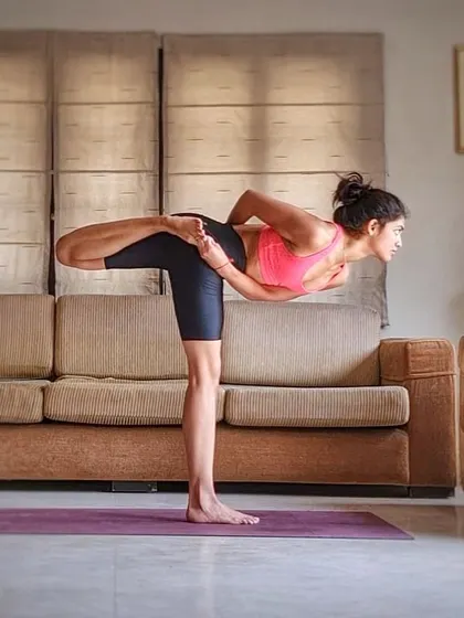 A twisting and balancing variation of Warrior III. This pose detoxifies the spine while challenging your stability and focus. A healthy spine leads to a healthy mind.