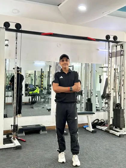 A confident pose in the gym at Noida Sector 45. I'm ready to help you achieve your goals.