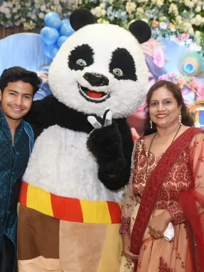 More guests enjoying their photo opportunity with the party mascot.