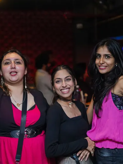 A group of friends enjoying the music and the lively atmosphere.