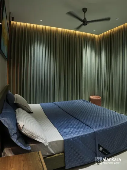 This bedroom is enveloped in elegant curtains that provide both privacy and style. The motion blur on the fan suggests a cool, comfortable environment perfect for restful sleep.