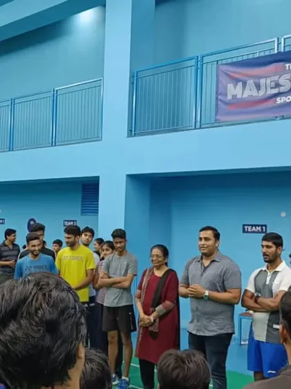 Parents and coaches gather to support the young players during one of our internal kids' badminton tournaments.