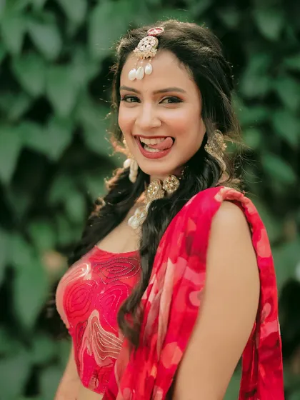 A playful and cheeky expression from the bride during her Haldi, showing her fun personality.