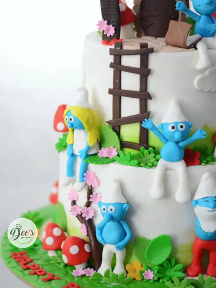 The whole gang is here, including Smurfette, hanging out around their mushroom village on this fun-filled birthday cake.