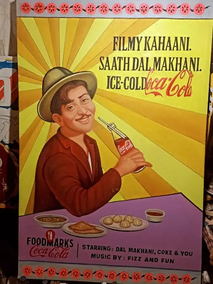 A hand-painted poster for a Coca-Cola event, featuring a portrait of the legendary actor Raj Kapoor. This piece combines celebrity portraiture with retro advertising style.