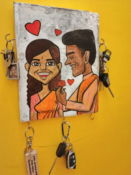 Looking for a gift that's both personal and practical? My custom caricature keychain holders are hand-painted on wood and are a unique way to organize your keys.