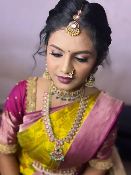 A close-up of the makeup, showing the soft purple eyeshadow and matching lip color.