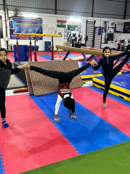 Teamwork makes the dream work. My gymnasts often practice flexibility and balance drills together, creating a supportive and motivating environment in the academy.