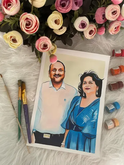 This is a finished portrait of a couple, showcasing my illustrative technique. The artwork is laid out with my brushes and paints to give you a sense of the tools I use for these custom pieces.