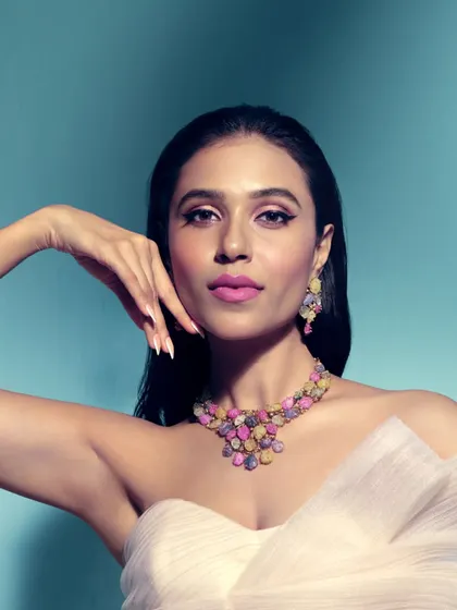 In hues of Tourmaline, her pride sparkles bright. This necklace is a symbol of her love, her journey, her light, designed for the bride who dares to be different.