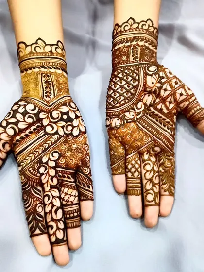 A beautiful example of using cutwork to create a "reverse" floral pattern on the back of the hand.