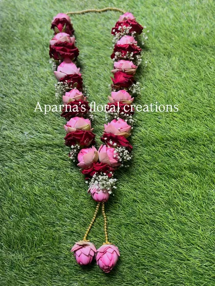 I combined pink lotus buds with deep red roses in this custom varmala. The contrast in color and texture makes it a unique and eye-catching piece for any ceremony.