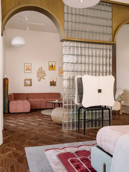 Looking from the sleeping area into the lounge of the daughter's bedroom, this shot shows how we used arches and glass blocks to define zones while maintaining an open, airy feel.