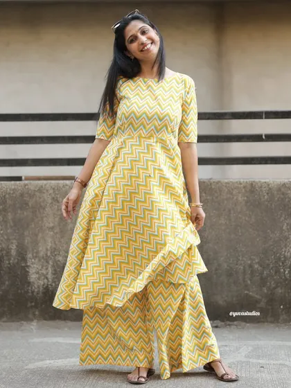 Comfy vibes only in this yellow chevron palazzo set. The bright pattern and relaxed fit make it a joy to wear.