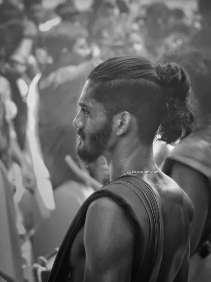 A black and white profile, capturing the focused and modern look of one of our artists.