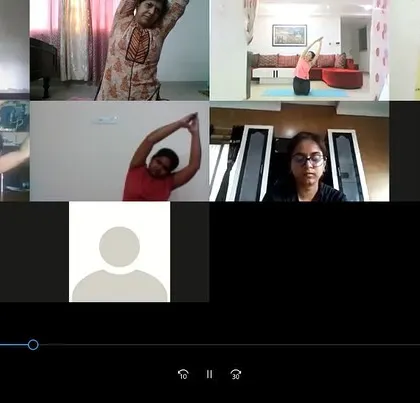 Participants in our online corporate session engage in a side body stretch. This is a great way to open up the rib cage and improve flexibility in the spine, even while seated.