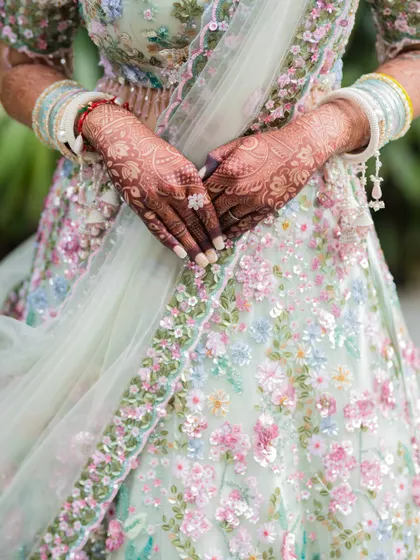 A close-up shot of the bride's intricate Mehendi. We pay attention to the small details, as they are a beautiful and important part of the wedding tradition.