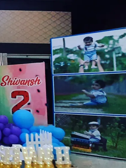 Another detail from the Cocomelon setup, showing a personalized milestone board and marquee letters spelling out the child's name, creating a unique and special photo corner.