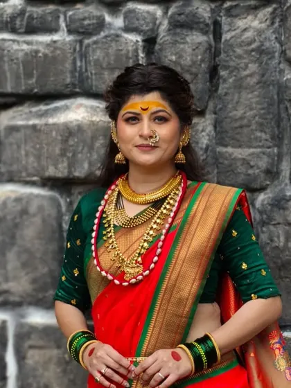 A direct-to-camera shot from the music video shoot. The makeup includes a traditional half-moon bindi and intense eyes to create a goddess-like appearance.