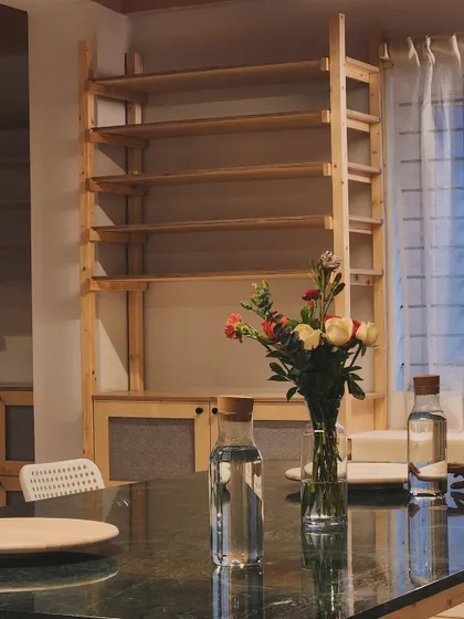Fresh flowers on the table are a small detail, but they bring life and color into the studio, reminding us to find beauty in the simple things.