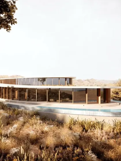 The full length of the villa's curved facade, showcasing its elegant integration with the hillside.