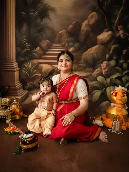A full view of the elaborate setup for the Krishna photoshoot, complete with traditional props like a flute and pot of butter.