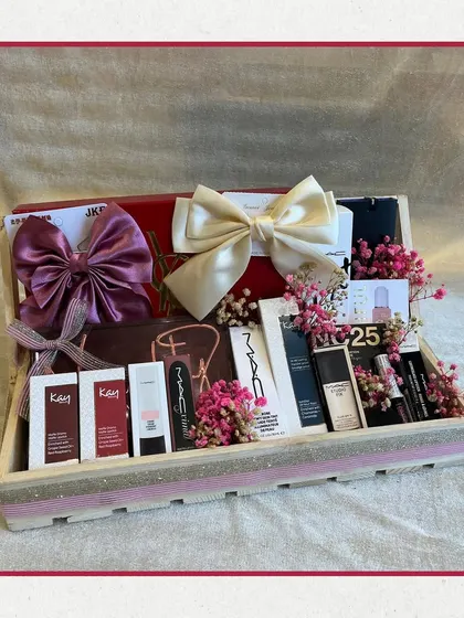 Another take on a beauty hamper, this one features products from MAC and Kay Beauty, presented in a stylish wooden tray with beautiful satin bows. It’s a perfect personalized gift for her.