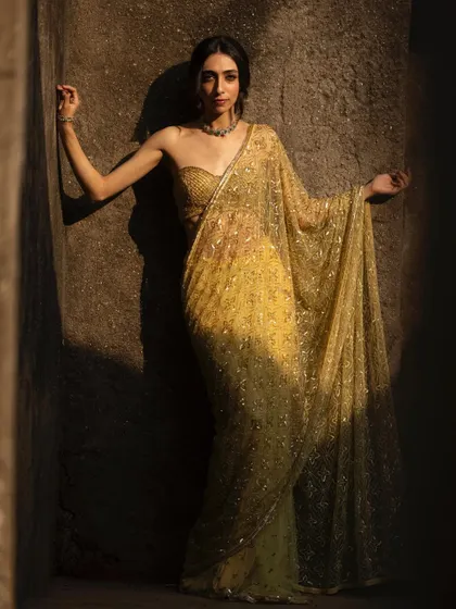 Playing with light and shadow in this gorgeous golden saree. The look felt incredibly regal.