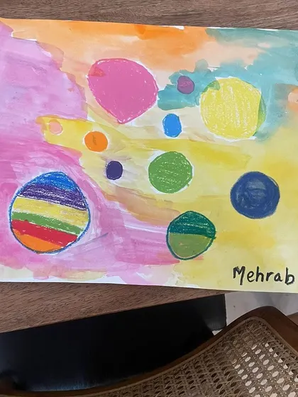 A beautiful, abstract dot painting on a colorful wash background, created during an online class.