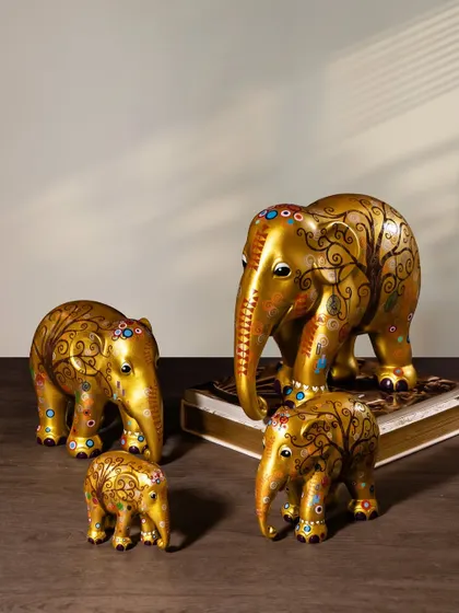 A different angle of the golden elephant family. Designed by talented artists, these sculptures are a unique blend of culture and craftsmanship, with a mission to raise awareness for elephant conservation.