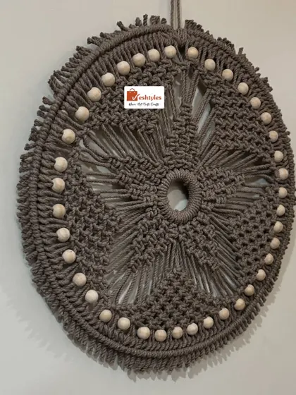 Another angle of the beaded mandala wall hanging. It's a perfect piece of home decor for anyone who loves bohemian or rustic style.