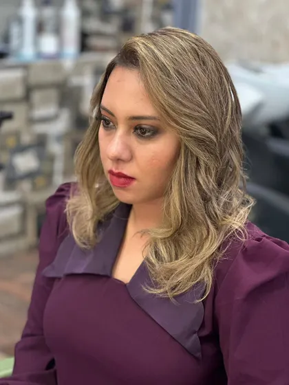 The client looking chic and stylish with her new blonde hair.