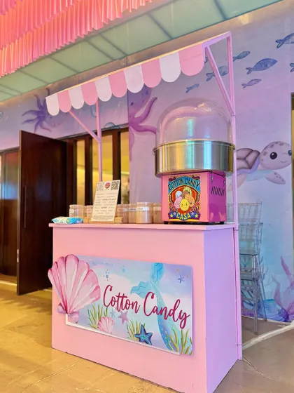 From a pastel soft play area and a cotton candy cart to a buffet with an LED screen backdrop showing aquatic life, every element was designed to immerse guests in Miraya's mermaid world.